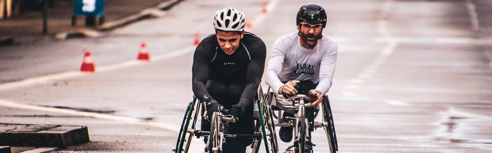 Men racing in wheelchairs